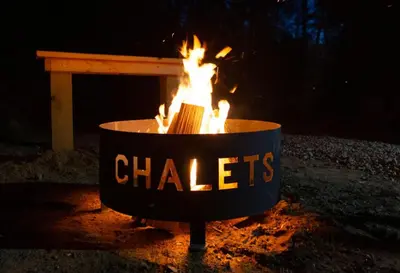 a fire pit with a sign that says chiefs at Legends Lane A - by The Chalets in Logan