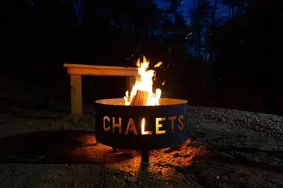 a fire pit with a sign that says chiles at Legends Lane B - by The Chalets in Logan