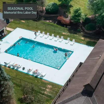 an overhead view of a swimming pool with people in it at Legends Lane B - by The Chalets in Logan