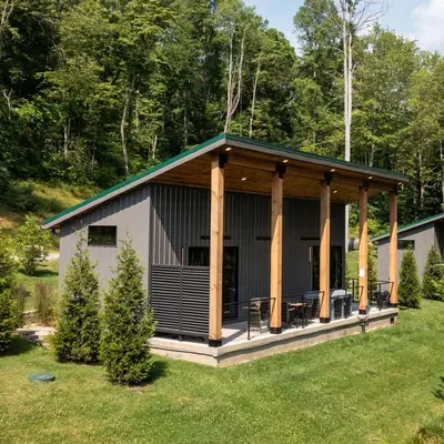 a screened in porch of a house with trees at Legends Lane C - by The Chalets in Logan