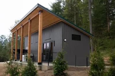 a large metal building with a large door at Legends Lane D - by The Chalets in Logan