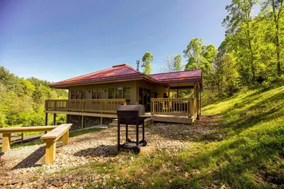 a house with a grill in front of it at Lilypad - by The Chalets in Logan