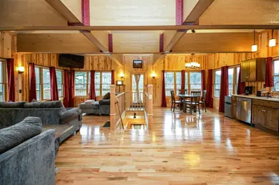 a large living room with a couch and a table at Lilypad - by The Chalets in Logan