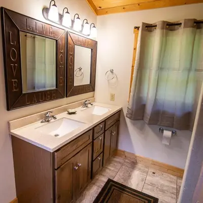 a bathroom with a sink and a mirror at Overlook - by The Chalets in Logan