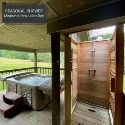 a shower on a screened in porch with a shower at Pine Cone - by The Chalets in Logan
