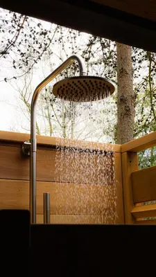 a shower with water coming out of it at Pine Cone - by The Chalets in Logan