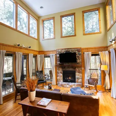 a living room with a couch and a fireplace at Ravine - by The Chalets in Logan