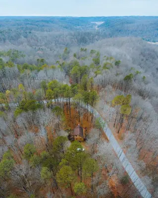 an overhead view of a cabin in a forest at Timber Ridge - by The Chalets in South Bloomingville