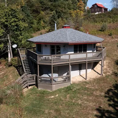 an aerial view of a house with a large deck at Treetop - by The Chalets in Logan