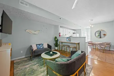 a living room with a couch and a table at 3BR Condo for 7 - Only 3 Miles to Ark Encounter! in Williamstown