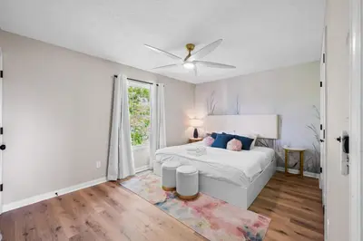 a white bedroom with a bed and a window at 3BR Condo for 7 - Only 3 Miles to Ark Encounter! in Williamstown