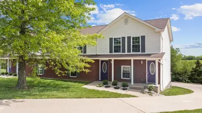 a house with a tree in front of it at 2BR Condo Near Ark for 6 Guests - Free Parking in Williamstown