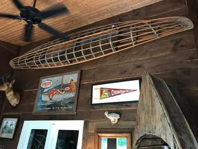 a bunk bed on the wall of a cabin at Getaway Inn at Cooper's Woods in Put-in-Bay