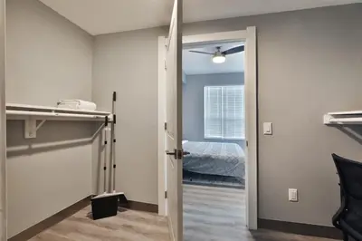a room with a door leading to a bedroom at The Buckeye's Gem Near Downtown & OSU in Columbus