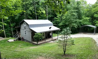 a tiny house in the middle of a yard at Secluded Cabin Rental, Perfect for an Ohio Retreat in Scio