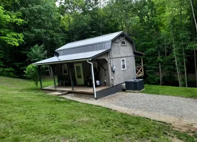 a small cabin in the middle of a yard at Secluded Cabin Rental, Perfect for an Ohio Retreat in Scio