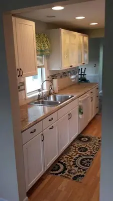 a kitchen with white cabinets and a sink at Idyllic Beachfront Vacation Rental on the Shores of Lake Erie in Northern Ohio in Vermilion