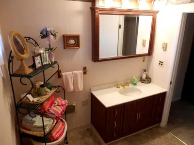 a bathroom with a sink and a mirror at Idyllic Beachfront Vacation Rental on the Shores of Lake Erie in Northern Ohio in Vermilion