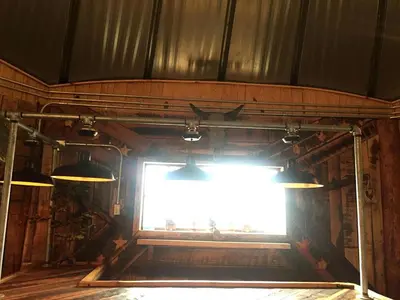 a stage with a bright light in a room at Unique Rustic Yurt Rental for a Peaceful Retreat near Huntington, West Virginia in Genoa