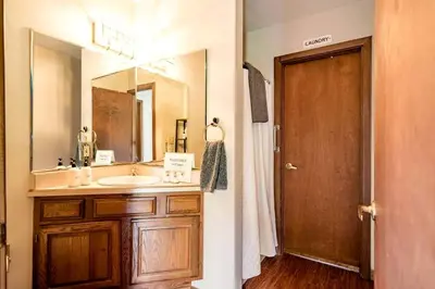 a bathroom with a sink and a large mirror at Stunning Home Away From Home in New Albany, Ohio, For Restful Escapes to Nature in New Albany