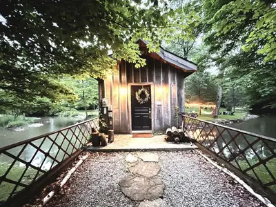 a small cabin in the middle of a river at Stunning Home Away From Home in New Albany, Ohio, For Restful Escapes to Nature in New Albany
