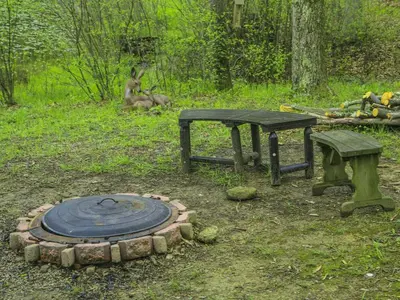 a park with a picnic table and a bench at Magnificent A-Frame Cabin Rental in the Trees close to Hocking Hills State Park, Ohio in Laurelville