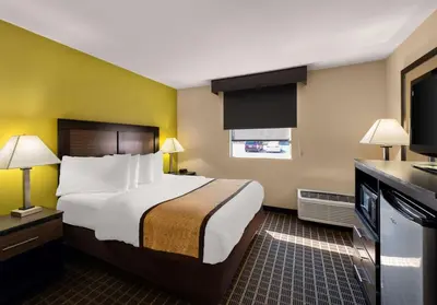 a hotel room with a bed and a television at Best Western Adena Inn in Chillicothe