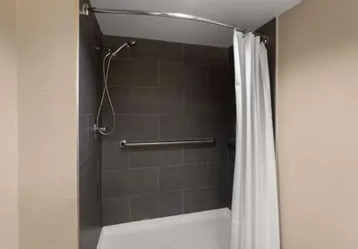 a bathroom with a shower with a shower curtain at Best Western Adena Inn in Chillicothe
