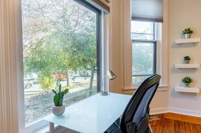 an office with a desk and a window at Shine Retreat - Private parking - Newly Reno - OSU in Columbus