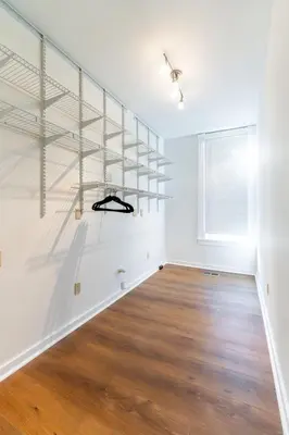 an empty room with white walls and wooden floors at Shine Retreat - Private parking - Newly Reno - OSU in Columbus
