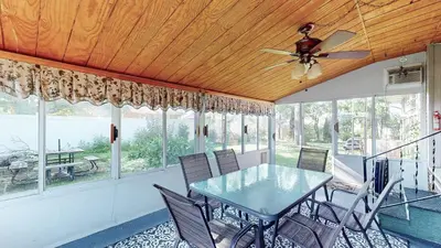 a dining room with a ceiling fan and a table and chairs at Sideline Sanctuary: Cozy Nights, Game Day Lights in Canton