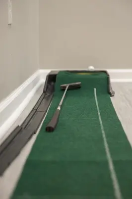 two baseball bats sitting on a green blanket at The Blitz House-Where Legends Unwind in Canton