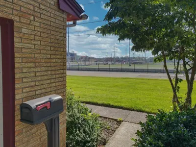 a mailbox on the side of a brick building at The Blitz House-Where Legends Unwind in Canton