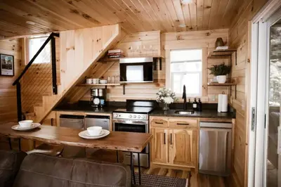 a kitchen with a table in a tiny house at Middlefork Ridge Entire Property in Laurelville