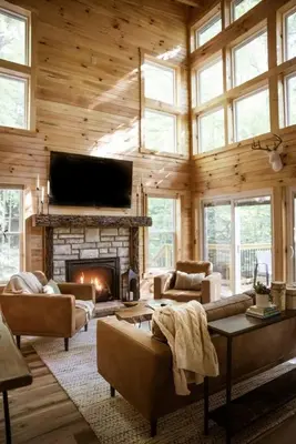 a living room with a fireplace and a tv at Middlefork Ridge Entire Property in Laurelville