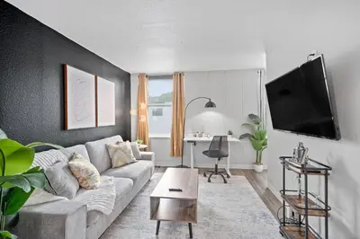 a living room with a couch and a table at Modern Stay Comfort-Free Parking in Cincinnati