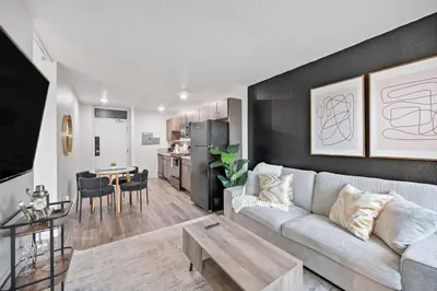 a living room with a couch and a table at Modern Stay Comfort-Free Parking in Cincinnati