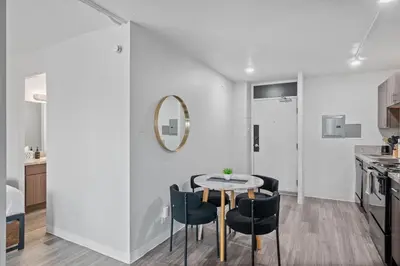 a kitchen and dining room with a table and chairs at Modern Stay Comfort-Free Parking in Cincinnati