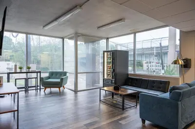 a living room with a couch and a table at Modern Stay Comfort-Free Parking in Cincinnati