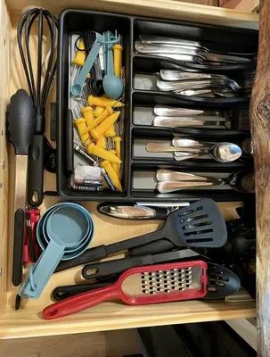 a drawer filled with lots of cooking utensils at Luminous Cabin near Tappan Lake with Hot-Tub, BBQ and Deck in Ohio in Deersville