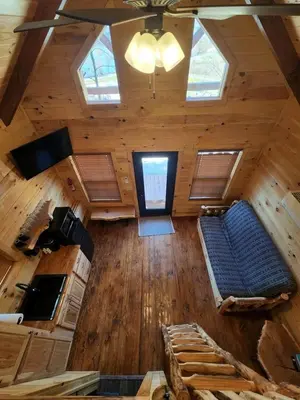 an overhead view of a living room in a log cabin at Wooden Chic Cabin Fully Stocked near Tappan Lake in Ohio in Deersville