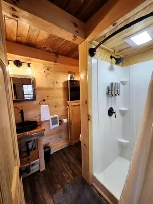 a bathroom with a shower and a sink at Gorgeous Cabin Great for Family Getaways by Tappan Lake in Ohio in Deersville