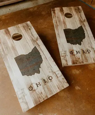 two pieces of wood with the initials fmt on it at 16 Guests | Ponds | Hot Tub | Game Room | Trails in Sarahsville