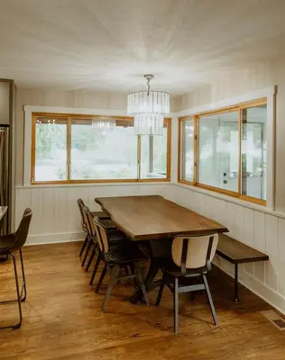 a dining room with a large wooden table and chairs at 16 Guests | Ponds | Hot Tub | Game Room | Trails in Sarahsville