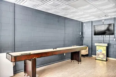 a ping pong table in a room with a tv at Exquisite Cabin with Amazing Interior and Exterior in Sarahsville, Ohio