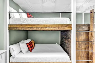 a couple of bunk beds in a room at Exquisite Cabin with Amazing Interior and Exterior in Sarahsville, Ohio