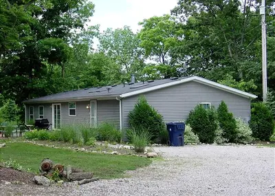 a house with a solar roof on top of it at Spacious Vacation Cottage Rental near the Waterfront in Beautiful Put-in-Bay, Ohio in Put-in-Bay
