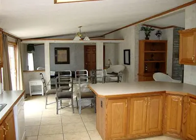 a kitchen and dining room with a table and chairs at Spacious Vacation Cottage Rental near the Waterfront in Beautiful Put-in-Bay, Ohio in Put-in-Bay