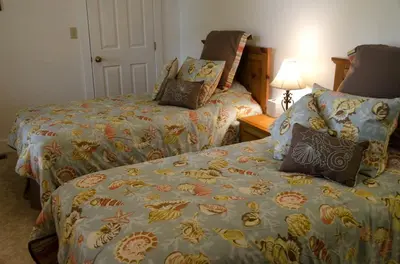 a hotel room with two beds and a lamp at Tranquil Weekend Getaway for a Large Group near the Cuyahoga Valley National Park, Ohio in Sandusky