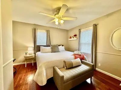 a bedroom with a bed and a ceiling fan at Hawks Nest in Marion